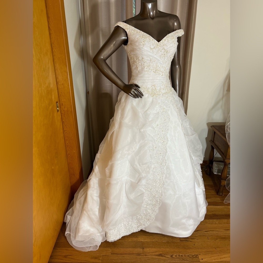 Beautiful white ballgown wedding gown with chapel length train.